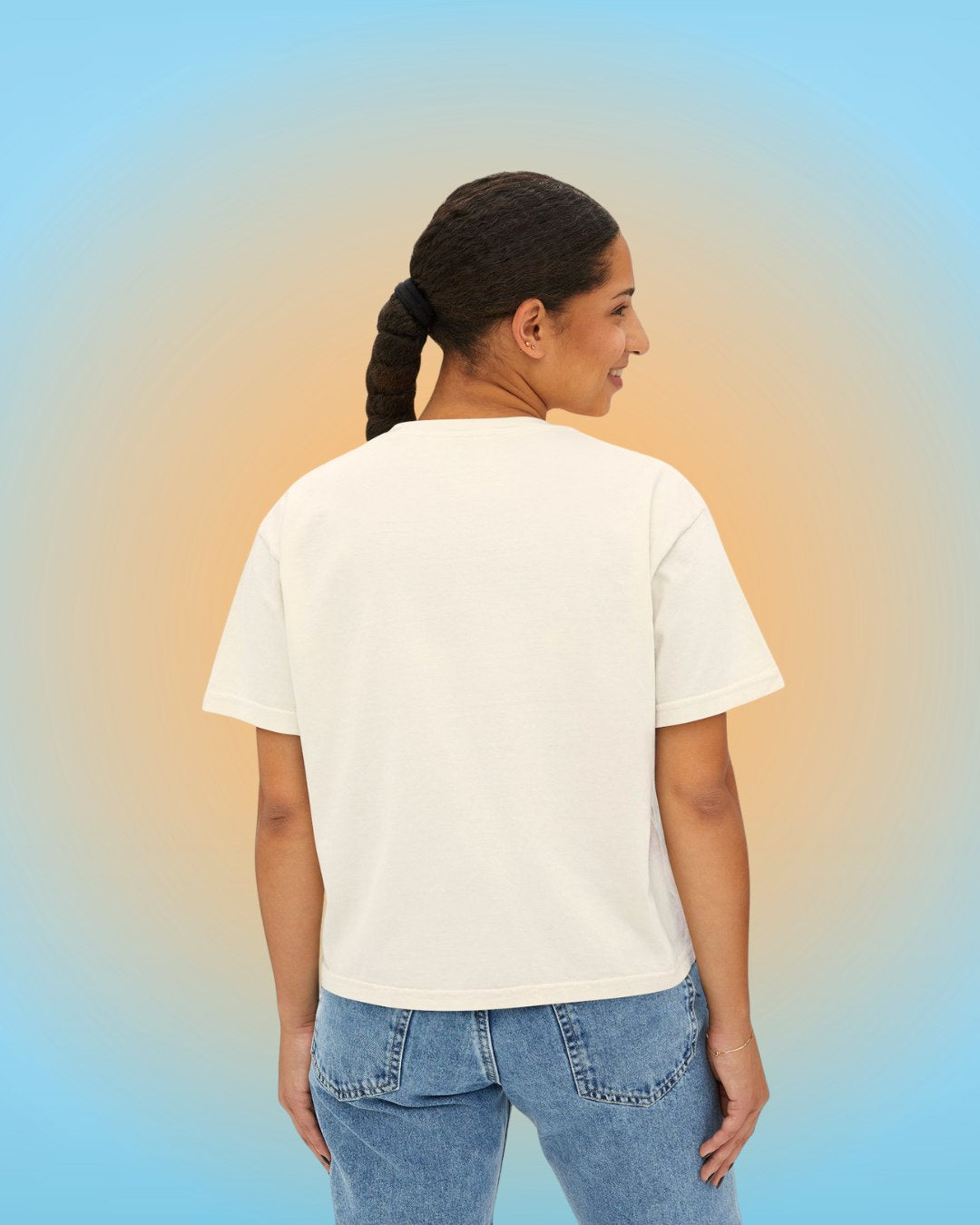Back view of ivory cropped t-shirt with oversized boxy silhouette.