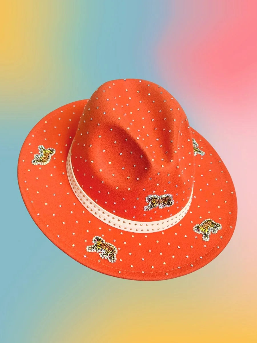 Sunset Prowl Fedora photographed from an angled side view, highlighting the studded cream hat band and rhinestone details.