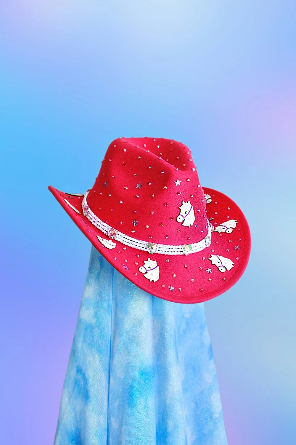 Front view of baby pink sushi cowboy hat with rhinestones and silver cord band.