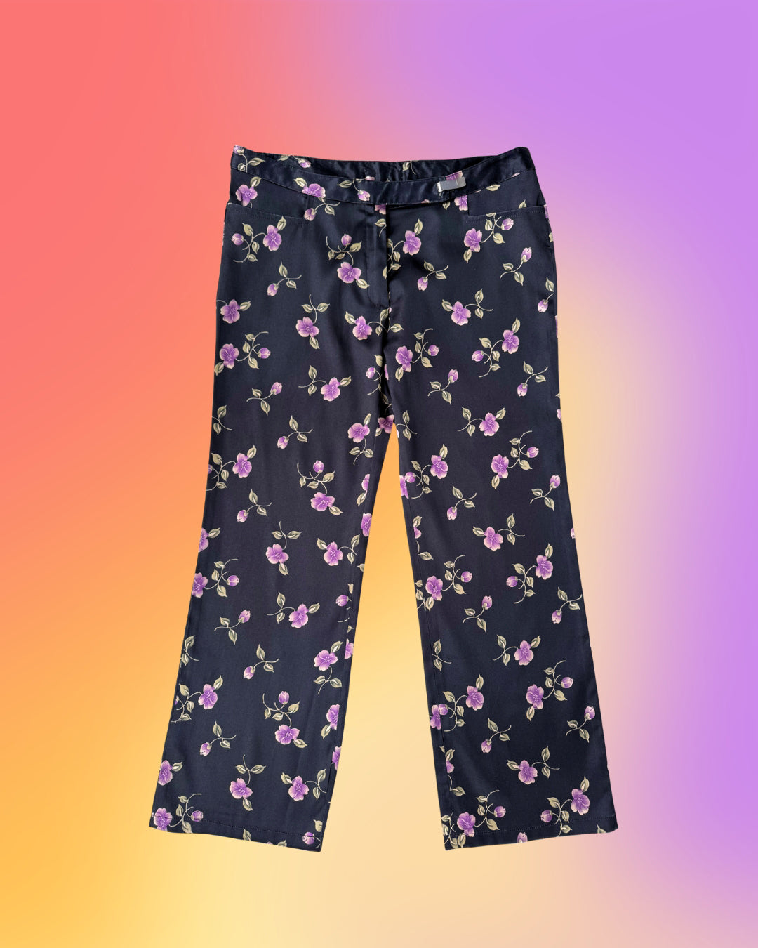 Vintage 1990s Parisian floral satin capri pants laid flat, petite cropped fit with purple floral print.