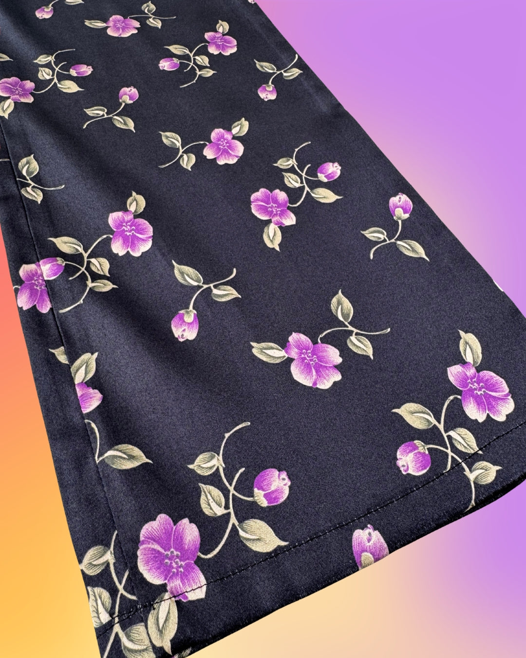 Cropped leg opening detail of vintage 1990s Parisian floral satin capri pants.