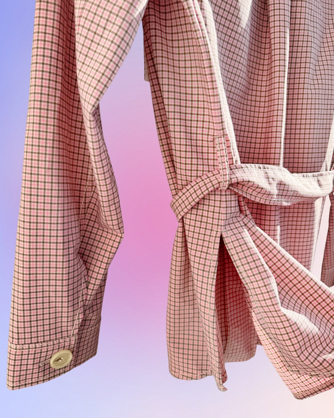 Close-up of removable self-tie belt on vintage W by Worth utility shirt jacket, showing cinched waist styling.